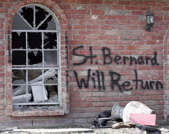 Words of encouragement are written on a house in Meraux, La., which lies in St. Bernard Parish in this 2005 file photo. This New Orleans suburb is still struggling to rebuild since the 2005 hurricane.