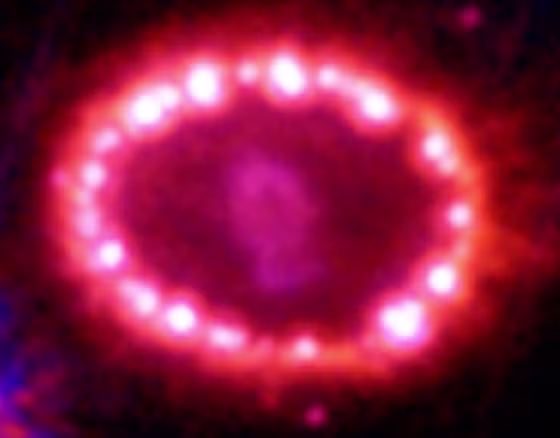 A shock wave from an exploding star known as Supernova 1987A lights up spots in a surrounding ring of dust and gas, in the latest snapshot from the Hubble Space Telescope.