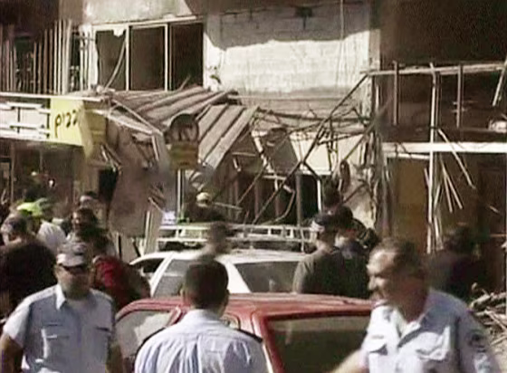 Emergency personnel work at the scene of an explosion at a money changer's shop in Tel Aviv&nbsp;on Thursday.