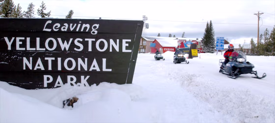 Snowmobilers Ride At Yellowstone National Despite Environmentalists Opposition
