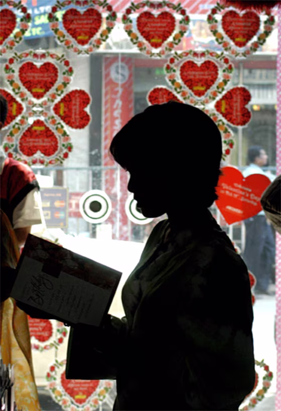 An Indian youth browses through Valentine's Day cards in a shop in Calcutta on Tuesday, despite Hindu nationalists' threats against those who celebrate the Western holiday.