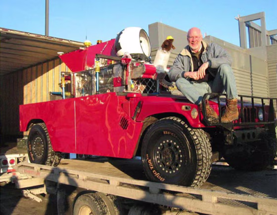 Red Team leader William "Red" Whittaker sits on Sandstorm, the Carnegie Mellon-based team's entry in&nbsp;the&nbsp;DARPA Grand Challenge race. Sandstorm is equipped with&nbsp;an autonomous guidance system&nbsp;designed for a 300-mile trip.