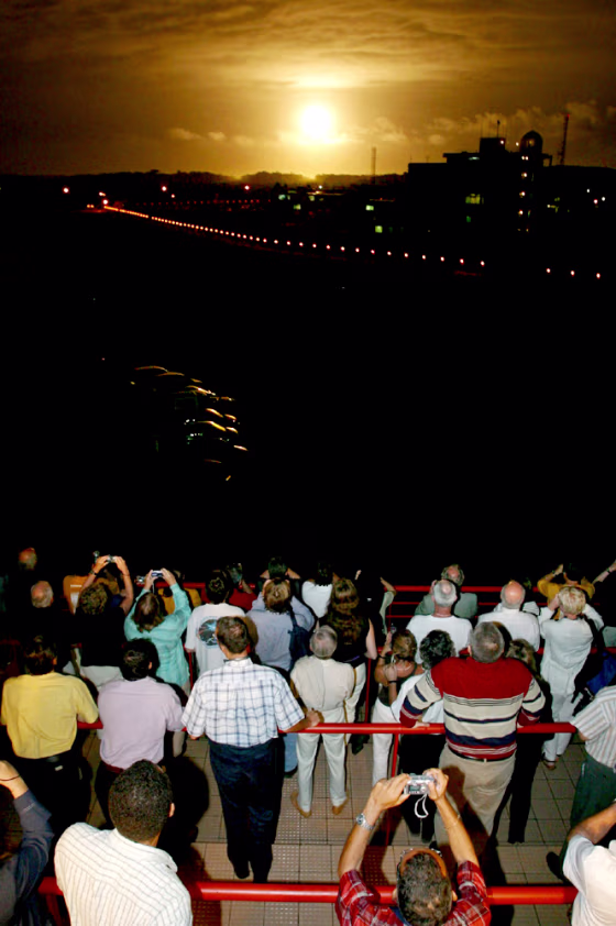 A crowd watches Tuesday's launch of the Ariane 5 rocket from the Kourou space center, bearing the European Space Agency's Rosetta comet probe into space.