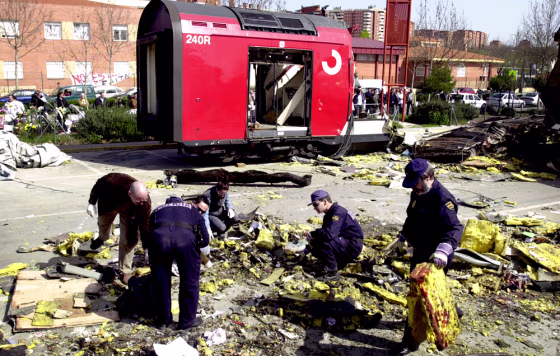 Police search for clues from the debris of one of the train bombings in the Madrid suburb of El Pozo on March 15. 