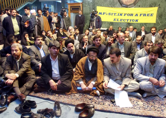 Iranian Interior Minister Abdulvahhab Musavie Lari, first row center with black turban, attends&nbsp;a reformist lawmakers sit-in protest on Jan. 12, after they were disqualified&nbsp;by hard-liners from running in the February legislative elections.