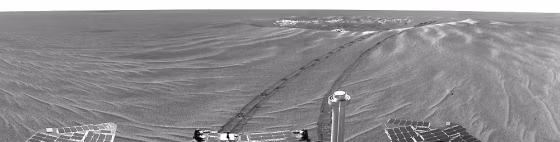 NASA's Opportunity rover takes its first panoramic image looking back at the crater where it landed.