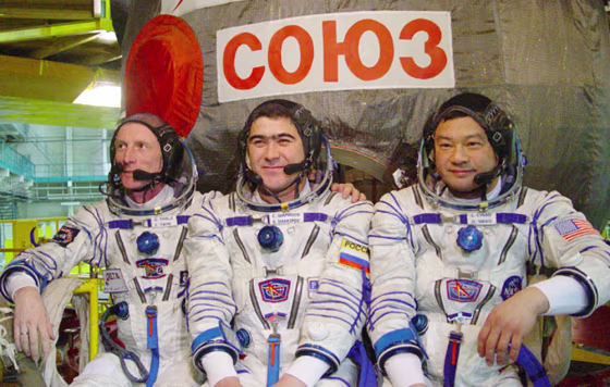 German astronaut Gerhard Thiele, Russian cosmonaut Salizhan Sharipov and NASA astronaut Leroy Chiao wear spacesuits during a training session this month. The Russians wanted Sharipov and Chiao to spend a year on the international space station, but NASA has objected. Thiele is to accompany Sharipov and Chiao to the station as a short-term visitor in October.