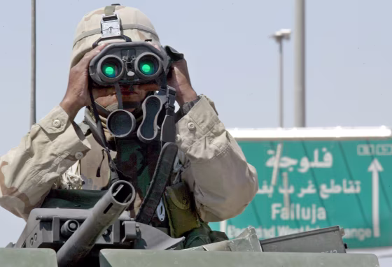 A U.S. soldier surveys his surroundings near one entrance to Fallujah earlier this week.