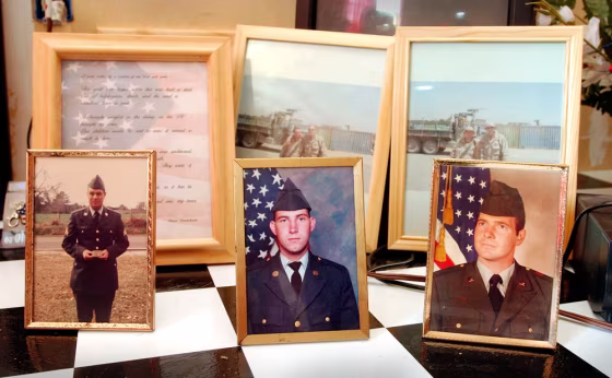 The Chance family of Kokomo, Miss., display undated photographs of their men who have been or currently are in the military, beginning with James A. Chance II, left, in an undated photograph taken in the early 1970s; a photograph of his son, James A. Chance III, center, who was killed in Iraq last year; and his uncle Cecil Chance, who is currently an Army helicopter pilot and has served in Iraq.