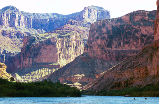 The Grand Canyon still imposes its majesty on visitors like the kayakers seen at right on the Colorado River, but a closer look finds a crumbling ecosystem.