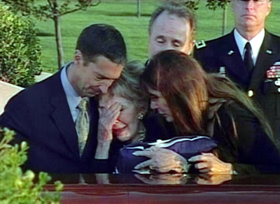 Former first lady Nancy Reagan, center, weeps as she touches the casket of her late husband, former President Ronald Reagan.