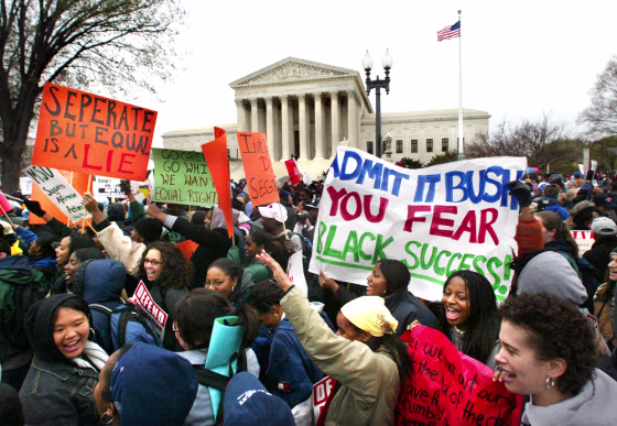 Students demonstrate outside the Supreme Court as it debated on April 1, 2003 in Washington whether colleges and universities could legally consider race when admitting students. 