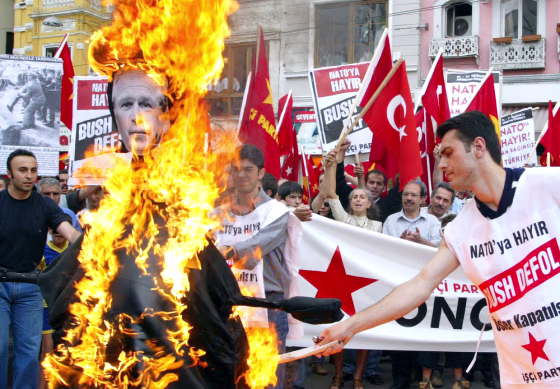 Members of Turkey's&nbsp;left-wing Labor Party set fire to&nbsp;an effigy of&nbsp;President Bush in downtown Istanbul on Sunday,&nbsp;just hours before Bush's arrival for a NATO summit.