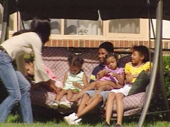 Cynthia Witt plays with her children at their Rockford, Ill., home.