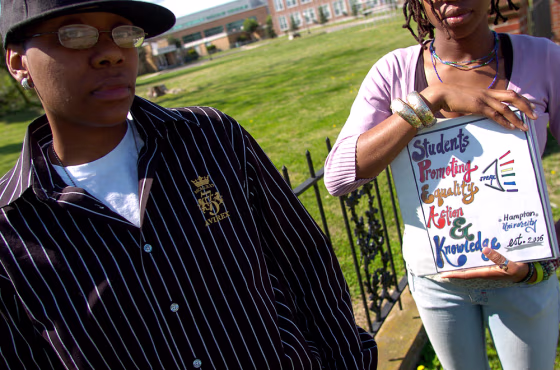 Hampton University graduate April Maxwell, left, and a current Hampton student, identified as S.M., demonstrate on March 30 in Hampton, Va.