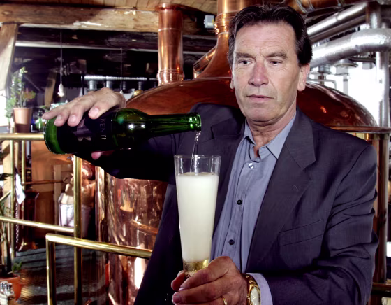 Brew master Kenth Persson pours a glass of his genetically modified beer at his brewery in Osterlen, Sweden.