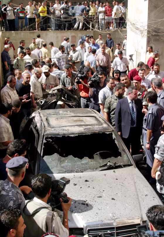 Lebanese security surround the car of Hezollah militia official Ghaleb Awali after a bomb exploded in&nbsp;the car, killing Awali, in the southern suburb of Beirut, Lebanon, on Monday.