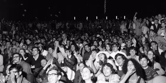 An estimated 10,000 people gathered to watch giant television screens in New York's Central Park and cheered on as astronaut Neil Armstrong took man's first step on the moon on July 20, 1969.