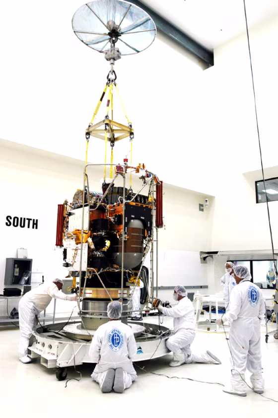 A crane lifts the Messenger spacecraft from its transporter inside the nonhazardous payload processing facility at Astrotech Space Operations in Titusville, Fla., earlier this summer.