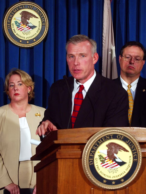 U.S. Attorney David Kelley speaks as Pasquale D'Amuro, assistant director of the FBI, right, and Linda Thomsen, left, the deputy enforcement director of the SEC, look on during a news conference Tuesday in New York to announce the filing of charges.