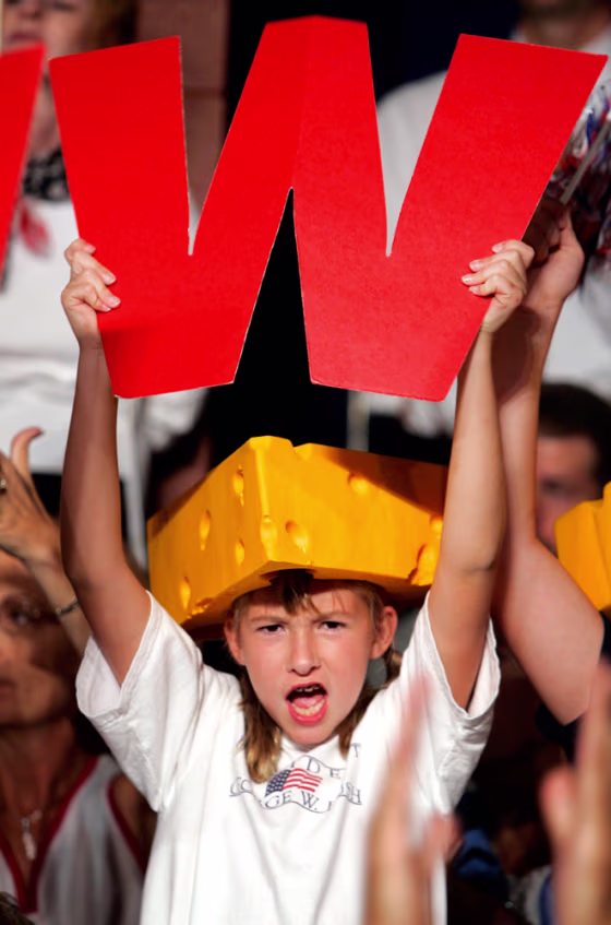 A young girl shows support for President Bush at a campaign rally in Wisconsin