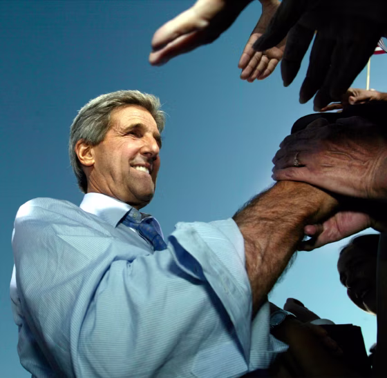 Democratic presidential nominee Kerry shakes hands with supporters after rally