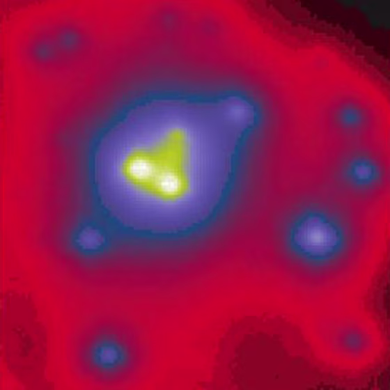 A dense cluster of seven massive stars appears to spiral around an intermediate-mass black hole. The whole setup orbits the Milky Way's central supermassive black hole, not show here. 