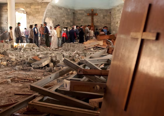 Iraqis gather inside the damaged St. Matthew Church in Baghdad, Iraq, on&nbsp;Nov. 9 following a car bomb attack.&nbsp; 