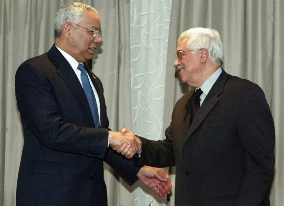 US Secretary of State Powell shakes hands with PLO chief Mahmoud Abbas in Jericho