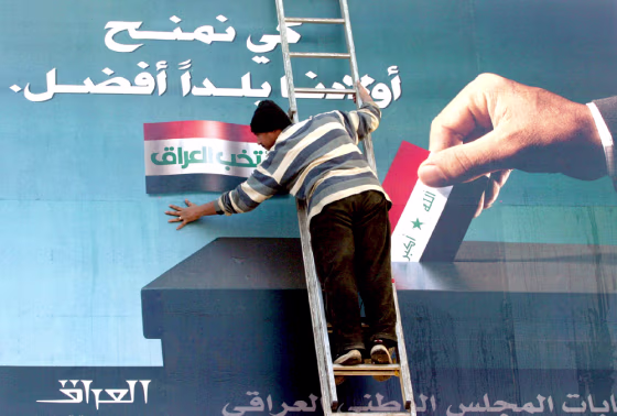 Billboard urging Iraqis to vote is prepared in Baghdad