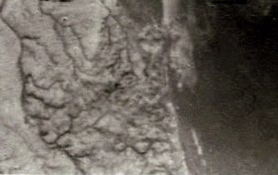 This image of Titan's surface was taken from a height of 10 miles (16 kilometers), as the Huygens probe descended toward landing.