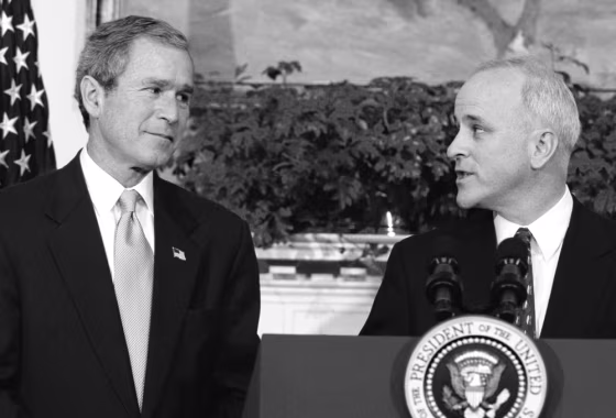 President Bush looks toward his Director of Faith Based and Community Initiatives, Jim Towey, during a Roosevelt Room ceremony, on Feb. 1, 2002.