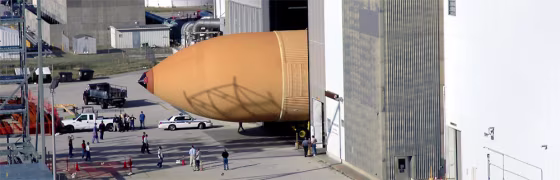 The shuttle's newly redesigned external tank disappears into the Vehicle Assembly Building at the Kennedy Space Center in Cape Canaveral, Fla, on Jan. 6.