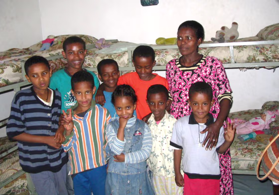 Wosene Maru, back right, cares for orphans whose parents have died from AIDS, in Addis Ababa, Ethiopia.