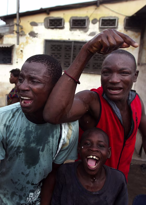 Anti-government protesters show their disapproval of Togo troops in the streets of Lome earlier this month.