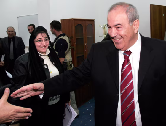 Iraqi interim Prime Minister Allawi greets supporters in Baghdad