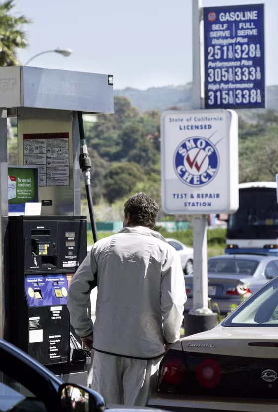 Americans are paying record amounts for gasoline because of surging crude prices and ever-increasing global demand for oil.