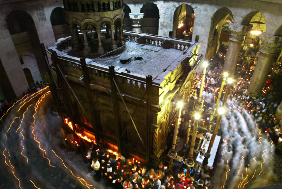 Following an Easter Sunday Mass, Catholic priests and pilgrims walk in a candle-light procession around the structure&nbsp;within the Church of the Holy Sepulcher which Roman Catholics believe is the tomb of Jesus Christ.
