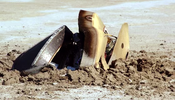 Genesis space capsule embedded in the earth after crashing in the Utah desert