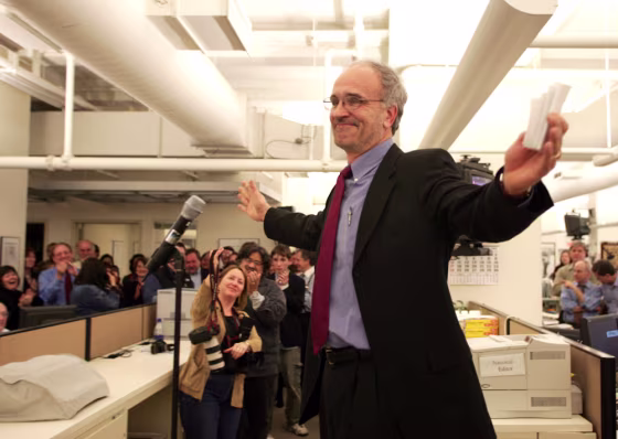New York Times reporter Walter Bogdanich, the 2005 Pulitzer Prize winner for national reporting, speaks to colleagues in the Times newsroom&nbsp;after his prize was announced Monday.