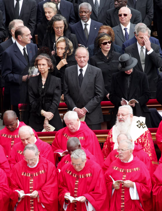 President&nbsp;Bush, right center, touches his forehead&nbsp;during the funeral of Pope John Paul II in St. Peter's Square at the Vatican on Friday. Standing to his left are&nbsp;first lady Laura Bush, Bernadette Chirac and French President Jacques Chirac.