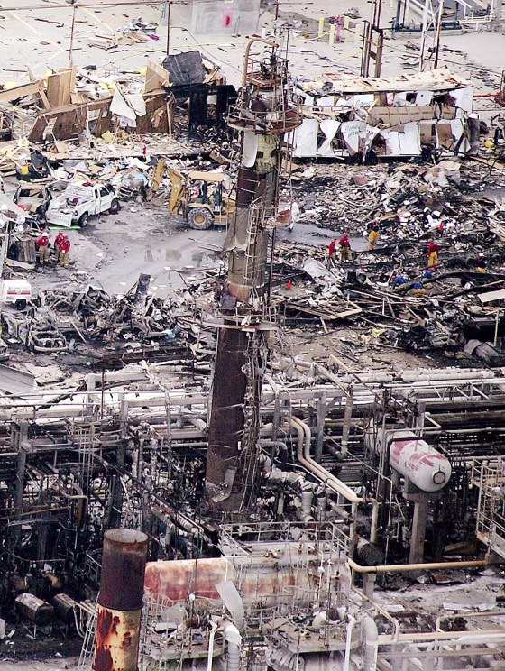 Workers sift through debris at the BP fa
