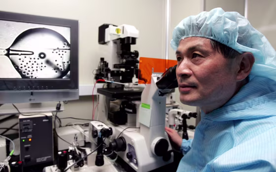 The head of a team of South Korean scientists, Woo-Suk Hwang, who cloned the first human embryo to use for research listens to a reporter's question during an interview with Reuters at his laboratory in Seoul