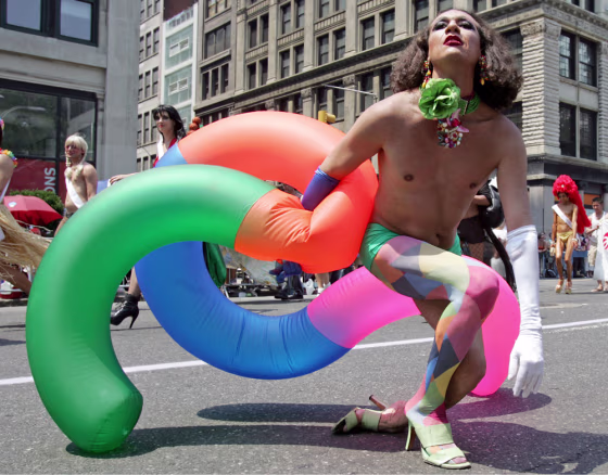 A participant marches down Fifth Avenue during the 36th Annual Pride March in New York