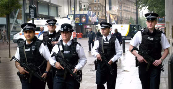 Armed British police patrol London's Leicester Square, Thursday July 28, 2005. Police in  London were on high alert, while the search for three suspected London bombers continued. Anti-terrorist officers investigating the July 21 failed attacks on the British capital arrested nine men in south London on Thursday.(AP Photo/Max Nash)