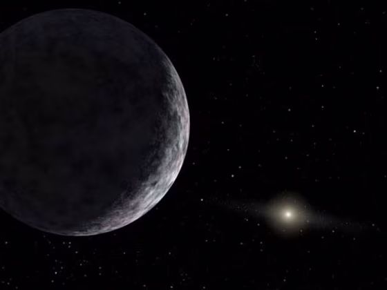 An artist's conception shows 2003 UB313, the purported 10th planet. Astronomers say the frozen world&nbsp;is larger than Pluto. The sun is in the far background. 