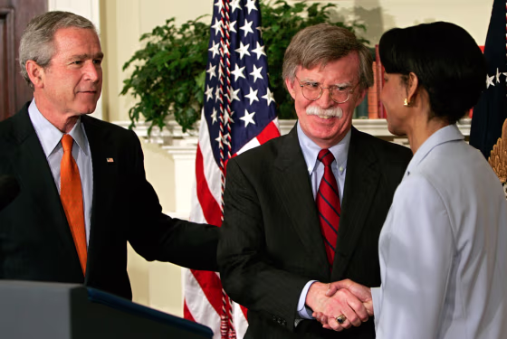 John Bolton (C) is congratulated by US S