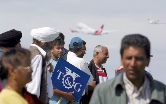 Fired employees for the U.S.-owned&nbsp;company Gate Gourmet, which provides onboard meals for British Airways flights, picket Saturday at Heathrow Airport in London.&nbsp;The airline&nbsp;said it would take several days to clear a backlog of passengers stranded by a daylong strike.