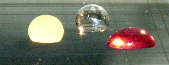 Two carbon nanotube sheets support droplets of orange juice, water and grape juice. The mass of&nbsp;each droplet is up to 50,000 times that of the contacting sheets.