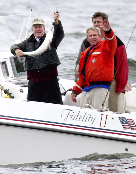 US President George W. Bush (R front) wa